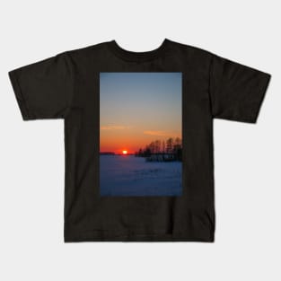 Sunset winter landscape with snow-covered road in violet and pink colors Kids T-Shirt